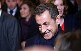 Former French President Nicolas Sarkozy leaves his headquarters, in Paris, Saturday, Nov. 29, 2014. (photo credit: AP Photo/Thibault Camus)