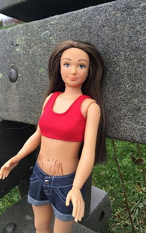 The Lammily Marks, a $6 packet of reusable stickers, give the doll anything from grass stains, to boo boos, to cellulite and stretch marks. (Lammily.com)