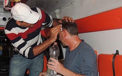 Screenshot from the news website Bokra.net showing an Israeli man receiving treatment after being attacked by rioters on a road near Taibe, November 9, 2014. Screenshot from the news website Bokra.net showing an Israeli man receiving treatment after being attacked by rioters on a road near Taibe, November 9, 2014.