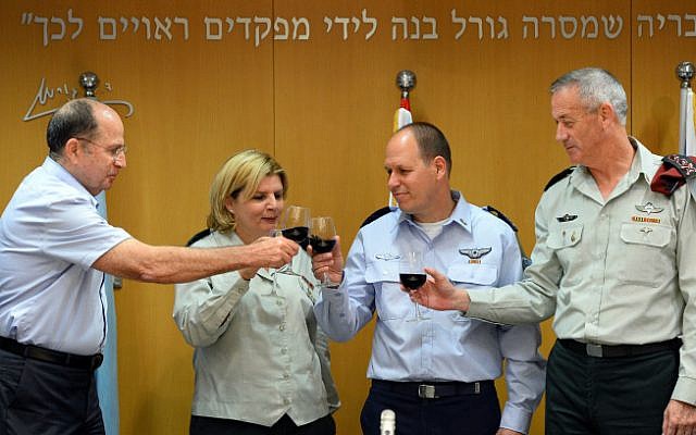 Maj. Gen. Hagi Topolinski, head of IDF Manpower Division, second from right, with his predecessor Maj. Gen. (res) Orna Barbivai (photo credit: IDF Spokesperson's Unit/ Flash 90)