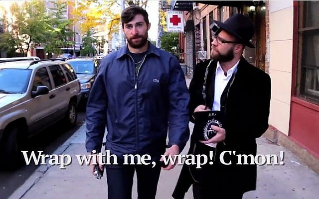 Scott Rogowsky is harassed on the streets of New York by Orthodox men in his parody video. (YouTube screenshot) Scott Rogowsky is harassed on the streets of New York by Orthodox men in his parody video. (YouTube screenshot)