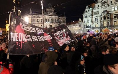 Potestors hold up banner reading "Together against Neo Nazis and racism" during a demonstration under the slogan "Dresden Nazi-free" against the "Patriotic Europeans Against the Islamisation of the Occident" (PEGIDA) in Dresden, eastern Germany, on December 22, 2014. (Kay Nietfield, AFP) Potestors hold up banner reading "Together against Neo Nazis and racism" during a demonstration under the slogan "Dresden Nazi-free" against the "Patriotic Europeans Against the Islamisation of the Occident" (PEGIDA) in Dresden, eastern Germany, on December 22, 2014. (Kay Nietfield, AFP)