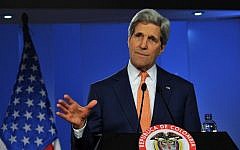 US Secretary of State John Kerry speaks next to Colombian President Juan Manuel Santos (out of frame) during a press conference they gave after a meeting at Narino presidential Palace in Bogota, on December 12, 2014. (photo credit: AFP/Guillermo LEGARIA)