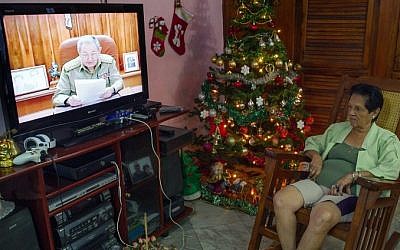 A local watches Cuban President Raul Castro on TV while he addresses the country, on December 17, 2014 in Havana. (photo credit: AFP/YAMIL LAGE) A local watches Cuban President Raul Castro on TV while he addresses the country, on December 17, 2014 in Havana. (photo credit: AFP/YAMIL LAGE)