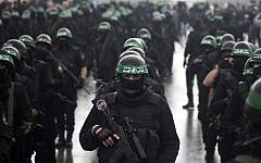 Members of the al-Qassam Brigades, Hamas's armed wing, take part in a parade marking the 27th anniversary of the Islamist movement’s creation on December 14, 2014 in Gaza City. (photo credit: AFP/Mahmud Hams)