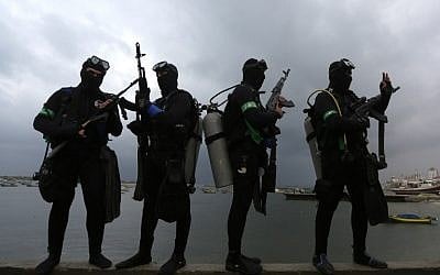 Palestinian divers from the al-Qassam Brigades, Hamas' armed wing, take part in a parade marking the 27th anniversary of the Islamist movement’s creation on December 14, 2014 in Gaza City. (photo credit: AFP/ MAHMUD HAMS)