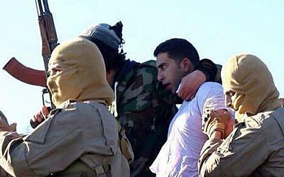 A still image released by the Islamic State's branch in Raqqa, Syria on jihadist websites on December 24, 2014 purportedly shows Jordanian pilot First Lieutenant Mu’ath al-Kaseasbeh. (AFP/HO/ Welayat Raqa)