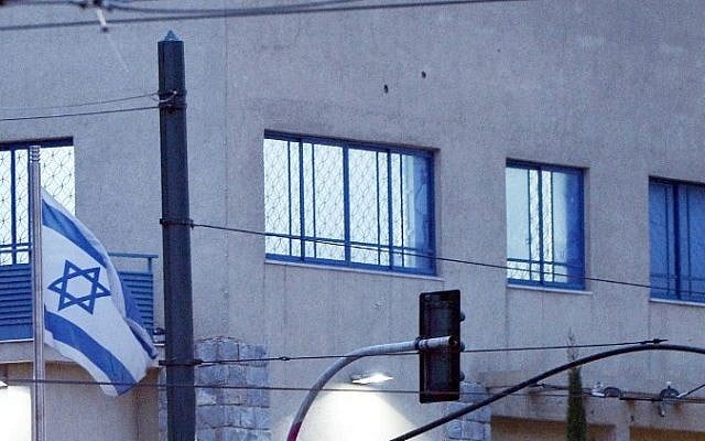 Bullets holes are seen on the Israeli embassy building in Athens on December 12, 2014. (Photo credit: AFP/ LOUISA GOULIAMAKI) Bullets holes are seen on the Israeli embassy building in Athens on December 12, 2014. (Photo credit: AFP/ LOUISA GOULIAMAKI)