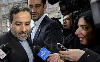 Iranian Deputy Foreign Minister Abbas Araqchi enters the mission of the European Union building on December 17, 2014 in Geneva. (Photo credit: AFP/ FABRICE COFFRINI)