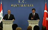 Iraqi Prime Minister Haider al-Abadi (L) and Turkey's Prime Minister Ahmet Davutoglu give a press conference in Ankara on December 25, 2014. (AFP/ Adem Altan)
