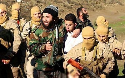 A still image released by Islamic State on jihadist websites on December 24, 2014, purportedly shows a Jordanian pilot captured by IS after they shot down a warplane from the US-led coalition near Raqqa, Syria. (photo credit: AFP/HO/Welayat Raqa)