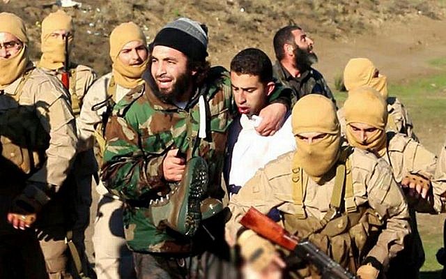 A still image released by Islamic State on jihadist websites on December 24, 2014, purportedly shows a Jordanian pilot captured by IS after they shot down a warplane from the US-led coalition near Raqqa, Syria. (photo credit: AFP/HO/Welayat Raqa) A still image released by Islamic State on jihadist websites on December 24, 2014, purportedly shows a Jordanian pilot captured by IS after they shot down a warplane from the US-led coalition near Raqqa, Syria. (photo credit: AFP/HO/Welayat Raqa)