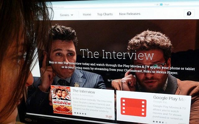 In this December 24, 2014 photo illustration a woman looks at the Google Play purchase page for the Sony film "The Interview," in Washington, DC. (photo credit: AFP PHOTO / STF) In this December 24, 2014 photo illustration a woman looks at the Google Play purchase page for the Sony film "The Interview," in Washington, DC. (photo credit: AFP PHOTO / STF)