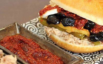 The Tunisian version of fricassee, stuffing a fried roll with flaky tuna, hard-boiled eggs, preserved lemons and spicy harissa (photo credit: Andrea Brownstein/Photoli Photography)