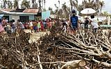 Children and IsraAid volunteers in the Philippines after Typhoon Hagupit wreaked havoc, on December 22, 2014. (photo credit: Courtesy IsraAid)