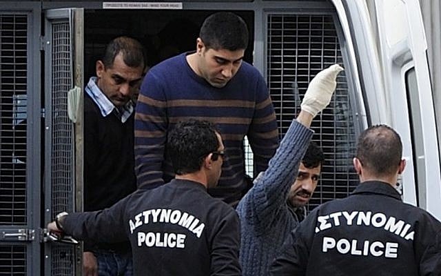 Riot police lead Hossam Taleb Yaacoub, a 24-year-old Swedish-Lebanese citizen, center top, to the court in the southern port city of Limassol Cyprus, Thursday, March 7, 2013 photo credit: AP/Pavlos Vrionides Riot police lead Hossam Taleb Yaacoub, a 24-year-old Swedish-Lebanese citizen, center top, to the court in the southern port city of Limassol Cyprus, Thursday, March 7, 2013 photo credit: AP/Pavlos Vrionides
