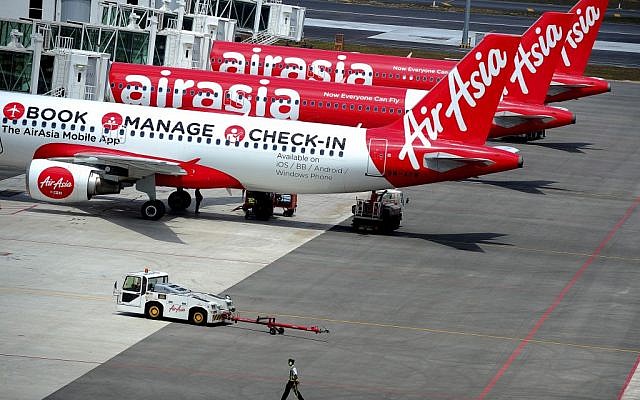 A fleet of AirAsia passenger jets on the tarmac of the new low cost terminal KLIA2 in Sepang, Malaysia, Tuesday, May 13, 2014 (photo credit: AP/Joshua Paul, File) A fleet of AirAsia passenger jets on the tarmac of the new low cost terminal KLIA2 in Sepang, Malaysia, Tuesday, May 13, 2014 (photo credit: AP/Joshua Paul, File)