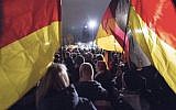 Illustrative image of Germans carrying flags during rally in Dresden, December 15, 2014. (AP/Jens Meyer)