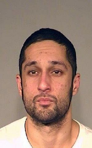 This photo provided by the Fresno Police Department shows Asif Mohammad Khan, who was arrested on suspicion of vandalizing the Islamic Cultural Center of Fresno on Christmas day 2014. (photo credit: AP/Fresno Police Department)