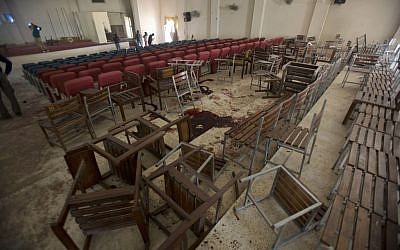 Overturned chairs and blood stains the floor at the Army Public School auditorium the day after Taliban gunmen stormed the school in Peshawar, Pakistan, Wednesday, Dec. 17, 2014. (photo credit: AP/B.K. Bangash) Overturned chairs and blood stains the floor at the Army Public School auditorium the day after Taliban gunmen stormed the school in Peshawar, Pakistan, Wednesday, Dec. 17, 2014. (photo credit: AP/B.K. Bangash)