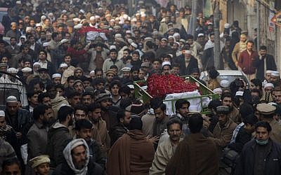 People attend funeral of a student killed the day before in a Taliban attack on a school in Peshawar, Pakistan, Wednesday, Dec. 17, 2014. (photo credit: AP/Mohammad Sajjad) People attend funeral of a student killed the day before in a Taliban attack on a school in Peshawar, Pakistan, Wednesday, Dec. 17, 2014. (photo credit: AP/Mohammad Sajjad)