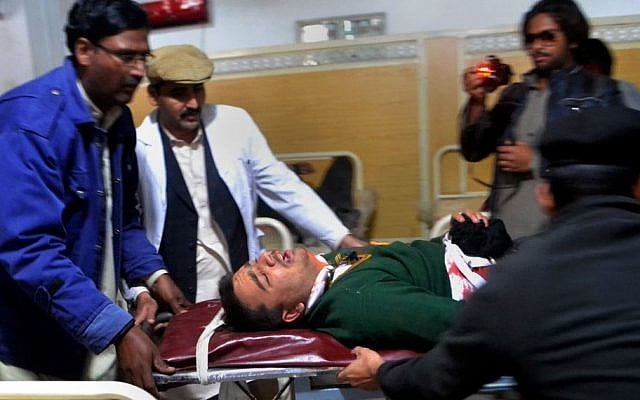 Hospital staff transport a student injured in the shootout at a school under attack by Taliban gunmen in Peshawar, Pakistan,Tuesday, Dec. 16, 2014. (photo credit: AP/Mohammad Sajjad)