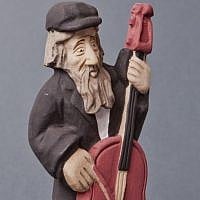 A Jewish figurine playing the cello, 2013 by Andrzej Biela (photo credit: Grzegorz Mart)