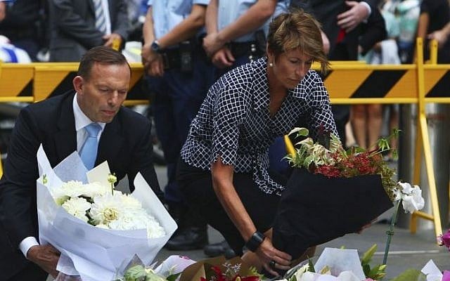 Australian Prime Minister Tony Abbott and his wife Margie pay their respect to the victims of the siege in Martin Place in Sydney central business district, Australia. Tuesday, Dec. 16, 2014. (Photo credit: Steve Christo) Australian Prime Minister Tony Abbott and his wife Margie pay their respect to the victims of the siege in Martin Place in Sydney central business district, Australia. Tuesday, Dec. 16, 2014. (Photo credit: Steve Christo)