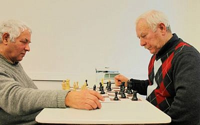 Elderly Russian immigrants play chess at their Makkabi Leipzig Jewish sports club. (Thomas Fritz/The Times of Israel)