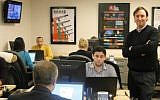 Josh Block (standing), president and CEO of The Israel Project, with staff in the Washington, DC office, in December 2014. (Ben Zehavi/The Times of Israel)