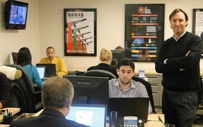 Josh Block (standing), president and CEO of The Israel Project, with staff in the Washington, DC office, in December 2014. (Ben Zehavi/The Times of Israel)