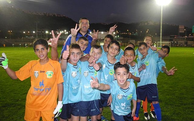The team from the Druze-Muslim village of Dalat al Karmel before taking the field against a team from the Jewish town of Tirat HaCarmel during Monday's tournament to commemorate the 100th anniversary of the Christmas Truce. (photo: Melanie Lidman/Times of Israel)