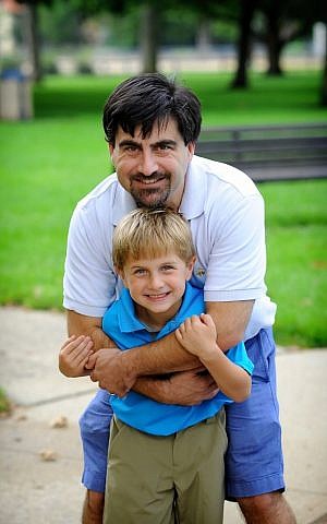 Neal Hoffman and his oldest son, the spark behind Mensch on a Bench. (Courtesy) Neal Hoffman and his oldest son, the spark behind Mensch on a Bench. (Courtesy)