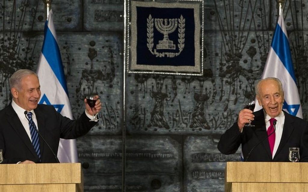 Prime Minister Benjamin Netanyahu and President Shimon Peres toast the new government at the President's Residence in Jerusalem, March 18, 2013. (Photo by Yonatan Sindel/Flash90) Prime Minister Benjamin Netanyahu and President Shimon Peres toast the new government at the President's Residence in Jerusalem, March 18, 2013. (Photo by Yonatan Sindel/Flash90)
