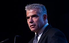 Yesh Atid party leader Yair Lapid speaks at a conference at the David Citadel Hotel in Jerusalem on December 11, 2014 (Miriam Alster/Flash90)