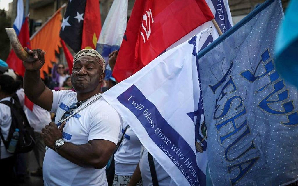Thousands of Christian Evangelists wave their national flag alongside the Israeli one as they march in a parade in the center of Jerusalem, marking the Jewish holiday of Sukkot or the Feast of the Tabernacles. October 14, 2014. (Hadas Parush/Flash90) Thousands of Christian Evangelists wave their national flag alongside the Israeli one as they march in a parade in the center of Jerusalem, marking the Jewish holiday of Sukkot or the Feast of the Tabernacles. October 14, 2014. (Hadas Parush/Flash90)