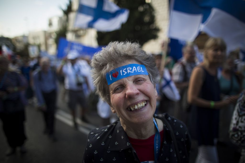 Thousands of Christian Evangelists wave their national flags and march in a Jerusalem parade marking the Feast of the Tabernacles, October 14, 2014. (Yonatan Sindel/Flash90)