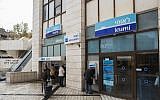 Illustrative image: Israelis walk next to Bank Leumi in Jerusalem on November 16, 2014. (Yonatan Sindel/Flash90)
