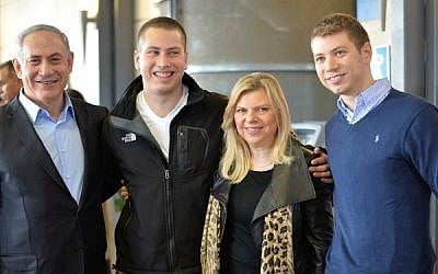 Prime Minister Benjamin Netanyahu and his wife Sara, seen with their sons Yair (R) and Avner (2L), at the Jerusalem's Ammunition Hill on December 01, 2014. (photo credit: Kobi Gideon/GPO)