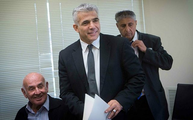 Finance Minister Yair Lapid (center) and Science Minister Yaakov Peri (left) at a Yesh Atid faction meeting in the Knesset, December 1, 2014. (Miriam Alster/Flash90) Finance Minister Yair Lapid (center) and Science Minister Yaakov Peri (left) at a Yesh Atid faction meeting in the Knesset, December 1, 2014. (Miriam Alster/Flash90)