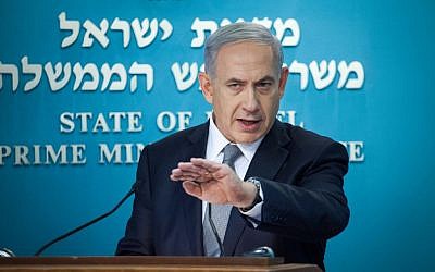 Prime Minister Benjamin Netanyahu addresses the press to announce new elections, Tuesday, December 2, 2014. (photo credit: Emil Salman/POOL)