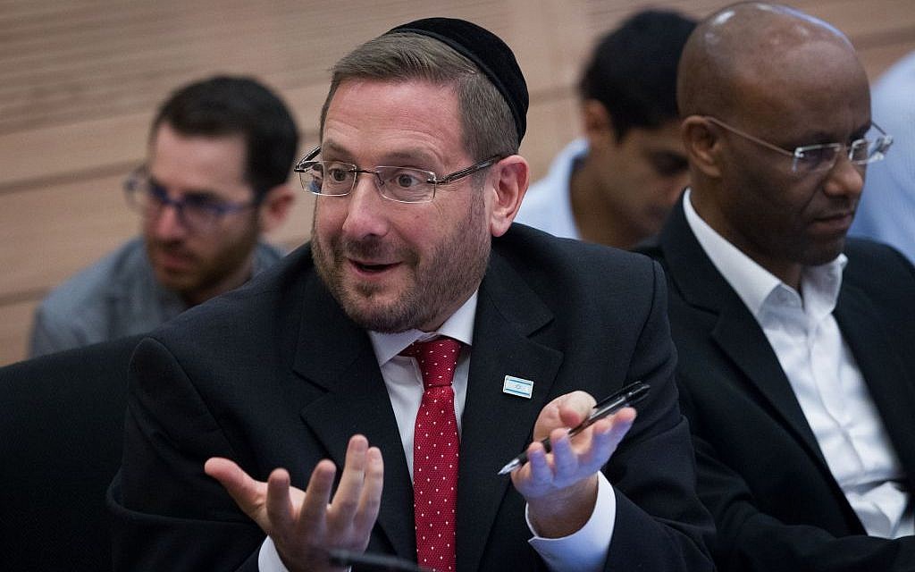 Yesh Atid MK Dov Lipman attempts to protest at the chaotic December 8, 2014 meeting of the Knesset Finance Committee (Miriam Alster/FLASH90) Yesh Atid MK Dov Lipman attempts to protest at the chaotic December 8, 2014 meeting of the Knesset Finance Committee (Miriam Alster/FLASH90)