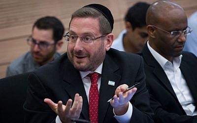Yesh Atid MK Dov Lipman attempts to protest at the chaotic December 8, 2014 meeting of the Knesset Finance Committee (Miriam Alster/FLASH90) Yesh Atid MK Dov Lipman attempts to protest at the chaotic December 8, 2014 meeting of the Knesset Finance Committee (Miriam Alster/FLASH90)