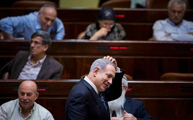 Prime Minister Benjamin Netanyahu in the Knesset during a vote on a bill to dissolve the 19th Knesset, December 8, 2014. (Yonatan Sindel/Flash90)