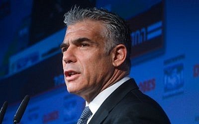 Leader of the Yesh Atid political party Yair Lapid speaks at the opening of the 'Globes Business Conference, in Tel Aviv on December 8, 2014. (photo credit: Flash90)