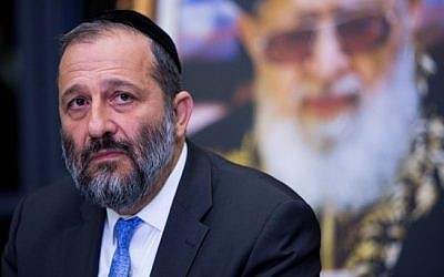Shas chairman Aryeh Deri at a press conference in Jerusalem, December 14, 2014. Behind him is a poster of the party's late spiritual leader, Rabbi Ovadia Yosef. (photo credit: Yonatan Sindel/Flash90)