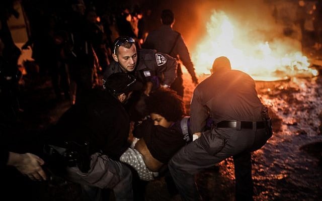 Police clash with Givat Amal residents December 29, 2014. (photo credit: Amir Levi/Flash90)