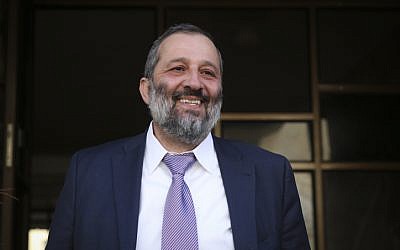 Aryeh Deri all smiles, after his resignation was rejected on December 30, 2014. (Hadas Parush/Flash90)