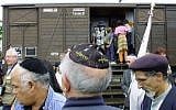 This Monday Aug. 20, 2001, file photo shows French Holocaust survivors gathering at the site of the former Drancy detention camp, north of Paris, France. From Aug. 20, 1941 until the end of World War II, more than 70,000 Jewish men, women and children passed through Drancy on their way to Nazi extermination camps, particularly Auschwitz. (AP Photo/Michel Euler)