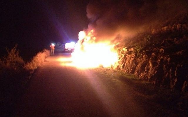 The car hit by a Molotov cocktail, in which 11-year-old Ayala Shapira and her father were injured, December 25, 2014. (photo credit: Judea and Samaria Fire Department)